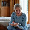Person taking notes and implementing health tips at home, showing actionable results.