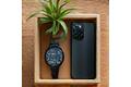Smartphone and smartwatch put away in a wooden box, symbolizing digital detox.